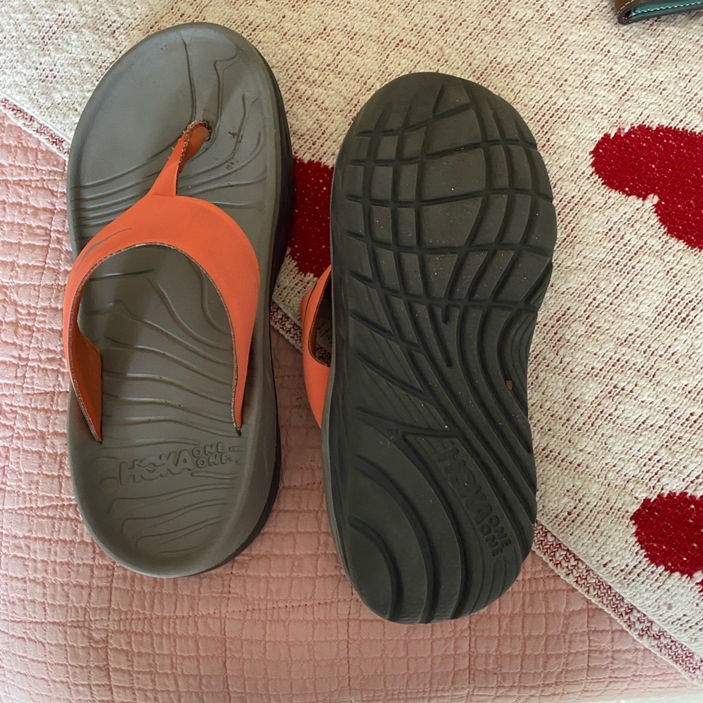 HOKA flip flops.  Orange.  A little too small.  Used but still in decent shape